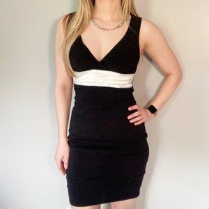Black fitted dress with white satin detail, small